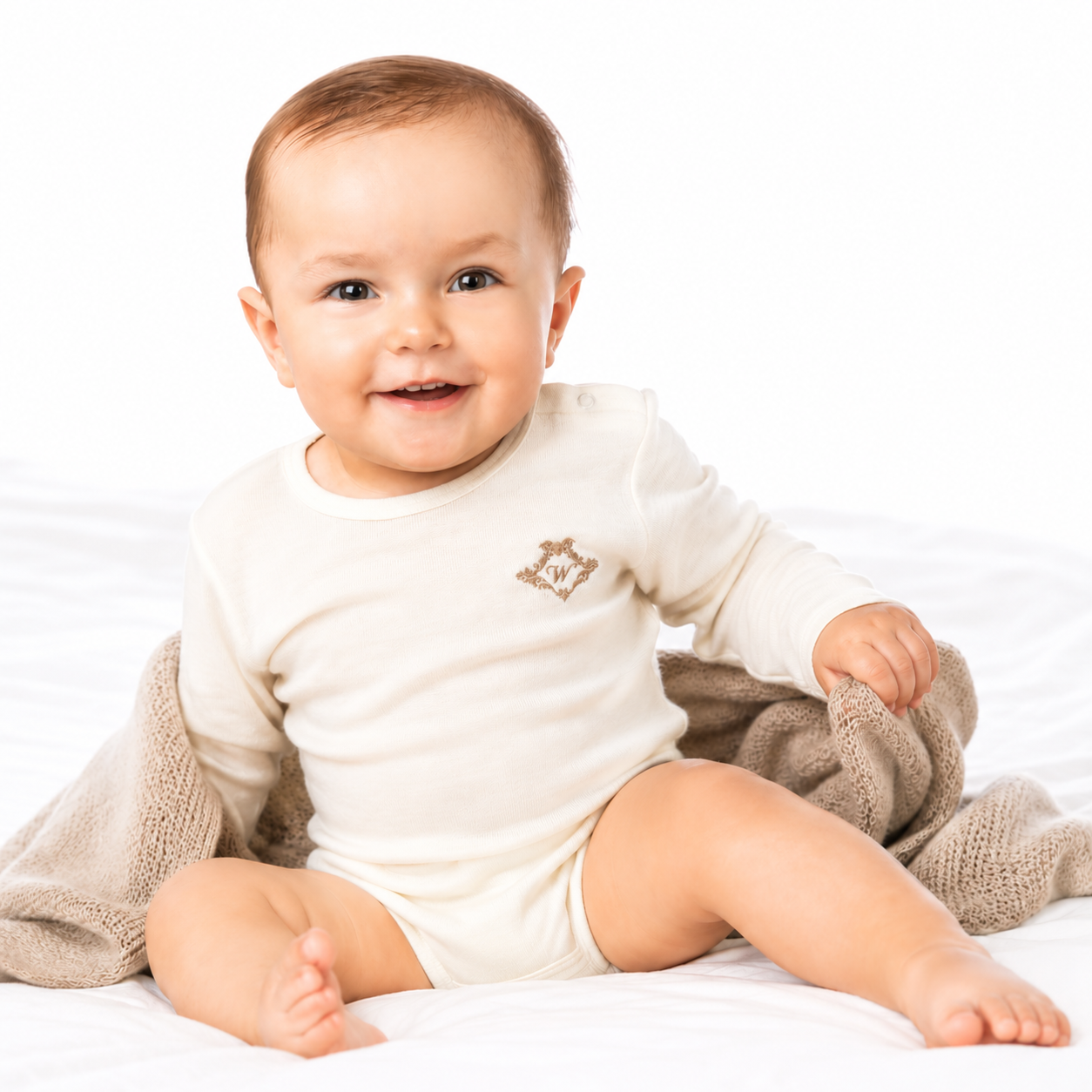 Baby Body aus 100 % Merinowolle | Langarm  mit Logo | Grösse 6–12 Monate